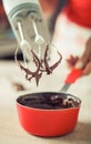 Woman hands mixing melted chocolate in the kitchen Royalty Free Stock Photo