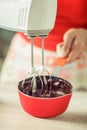 Woman hands mixing melted chocolate in the kitchen Royalty Free Stock Photo