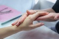 Woman hands in a nail salon receiving a hand massage by a beaut Royalty Free Stock Photo