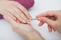 Woman hands in a nail salon receiving a manicure procedure. SPA manicure. Royalty Free Stock Photo