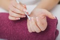 Woman hands in a nail salon receiving a manicure procedure. SPA Royalty Free Stock Photo