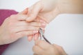 Woman hands in a nail salon receiving a manicure procedure. SPA Royalty Free Stock Photo