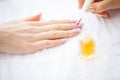 Woman hands in a nail salon receiving a manicure procedure. SPA Royalty Free Stock Photo