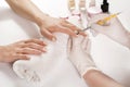 Woman hands in a nail salon receiving manicure with professional tool Royalty Free Stock Photo