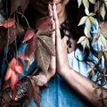 Closeup woman hands in namaste gesture outdoor shot Royalty Free Stock Photo