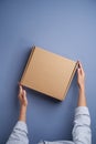 Woman hands open empty cardboard box, top view Royalty Free Stock Photo