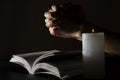 Woman hands, opened Bible and candle flame.Concept of praying to God Royalty Free Stock Photo