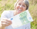Woman hands over hundred euro