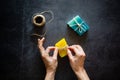 Woman hands packaging organic handmade soap bars. Top view.