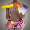 Woman hands with painting roller. Royalty Free Stock Photo