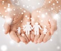 Woman hands with paper man family Royalty Free Stock Photo