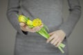 Woman hands with perfect nail art holding pink spring flowers tulips, sensual studio shot Royalty Free Stock Photo