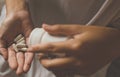 Woman hands with pills on spilling pills out of bottle,Female hand holding a medicine Royalty Free Stock Photo