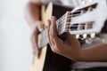 Woman hands playing acoustic classic guitar the musician of jazz and easy listening style select focus shallow depth of field and Royalty Free Stock Photo