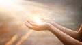 Woman hands praying on sunset background Royalty Free Stock Photo