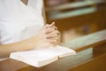 Woman hands praying on a holy bible in church for faith concept, Spirituality and Christian religion Royalty Free Stock Photo