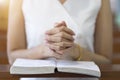 Woman hands praying on a holy bible in church for faith concept, Spirituality and Christian religion Royalty Free Stock Photo