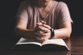 Woman hands praying to god with the bible. Woman pray for god blessing to wishing have a better life. begging for forgiveness and