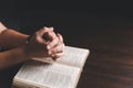 Woman hands praying to god with the bible. Woman pray for god blessing to wishing have a better life. begging for forgiveness and