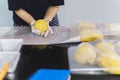 Woman hands preparing bread dough on black marble table. Royalty Free Stock Photo
