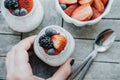 Woman hands with Pudding with chia seeds, yogurt and fresh fruit Royalty Free Stock Photo