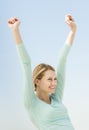 Woman With Hands Raised Looking Away Against Clear Sky Royalty Free Stock Photo