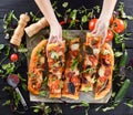 Woman hands reaching for big delicious mushroom pizza decorated Royalty Free Stock Photo