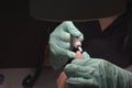 Woman hands receiving a manicure in beauty salon. Nail filing. Close up, selective focus Royalty Free Stock Photo