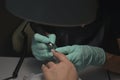 Woman hands receiving a manicure in beauty salon. Nail filing. Close up, selective focus Royalty Free Stock Photo