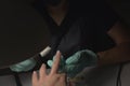 Woman hands receiving a manicure in beauty salon. Nail filing. Close up, selective focus Royalty Free Stock Photo