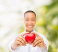 Woman hands with red heart