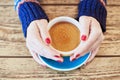 Woman hands with red manicure and cup of coffee Royalty Free Stock Photo