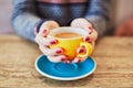 Woman hands with red manicure and cup of coffee Royalty Free Stock Photo