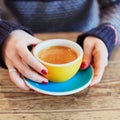 Woman hands with red manicure and cup of coffee Royalty Free Stock Photo