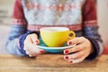 Woman hands with red manicure and cup of coffee Royalty Free Stock Photo