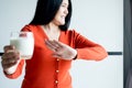 Woman hands refusing a glass of milk,Female having allergy milk,Lactose intolerance concept