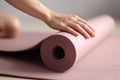 Woman hands rolling yoga mat on floor. Generate Ai