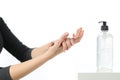 Woman hands rubbing sanitizer with bottle isolated on white