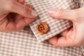 Woman Hands sewing button on fabric Royalty Free Stock Photo