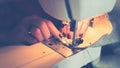woman hands sewing fabric on sewing machine Royalty Free Stock Photo