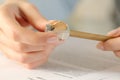 Woman hands sharpening pencil on a desk at home Royalty Free Stock Photo