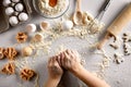 Baking preparation. Raw dough and cutters for the holiday cookies on a white table. Top view. Royalty Free Stock Photo