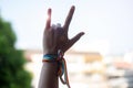 Woman hands showing love sign with LGBTQ Rainbow ribbon in the morning for Lesbian, Gay, Bisexual, Transgender and Queer community Royalty Free Stock Photo