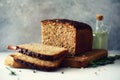 Woman hands slicing freshly backed bread. Handmade brown loaf of bread, bakery concept, homemade food, healthy eating Royalty Free Stock Photo