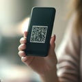 Woman hands smartphone with qr-code image