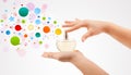 Woman hands spraying colorful bubbles from beautiful perfume bottle