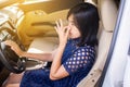 Woman hand squeeze her nose with of bad smell in a car Royalty Free Stock Photo