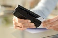 Woman hands stapling papers on a desk at home Royalty Free Stock Photo