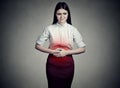 Woman with hands on stomach having bad aches pain Royalty Free Stock Photo