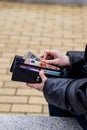 Woman hands taking money out of black leather purse Royalty Free Stock Photo